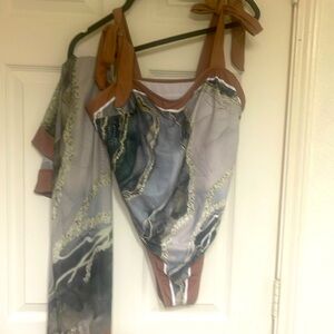 One piece swimsuit with matching coverup skirt